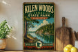 A vintage-style sign for Kilen Woods State Park in Minnesota, featuring a scenic landscape with a river, trees, and mountains.