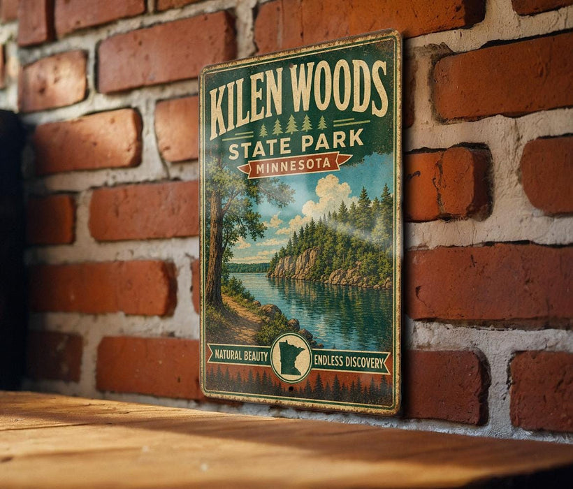 A vintage-style metal sign for Kilen Woods State Park in Minnesota, featuring a scenic landscape with a lake and forest.