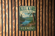 A vintage metal sign for Kill Kare State Park in Vermont, featuring a scenic landscape with a lake and mountains.