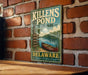 A vintage metal sign for Killens Pond State Park in Delaware, featuring a scenic illustration of the pond and surrounding landscape.