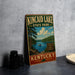 A vintage metal sign for Kincaid Lake State Park in Kentucky, featuring a scenic landscape with a lake, trees, and a boat.