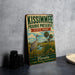 A vintage-style metal sign for Kissimmee Prairie Preserve, featuring a bird and palm trees, is displayed on a gray countertop.