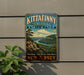 A vintage metal sign for Kittatinny Valley State Park, featuring a scenic landscape with a river and mountains.