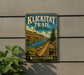 A metal sign for Klickitat Trail State Park in Washington, featuring a scenic mountain landscape with a river and pine trees.