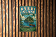 A vintage metal sign for Knight Island State Park in Vermont, featuring a scenic illustration of a lake, island, and canoe.