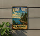 A vintage-style sign for Knight Point State Park in Vermont, featuring a scenic landscape with a lake, mountains, and pine trees.