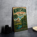 A vintage-style metal sign for Koreshan State Park in Florida, featuring a palm tree and a building, is displayed on a gray countertop next to some black camera lenses.