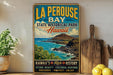 A vintage-style poster advertising La Perouse Bay, a state historical park in Hawaii, featuring a scenic image of the bay and mountains.