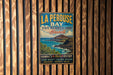 A vintage-style metal sign for La Perouse Bay State Historical Park in Hawaii, featuring a scenic image of the bay and mountains.