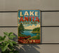 A vintage-style sign for Lake Anita State Park in Iowa, featuring a scenic landscape with a canoe on the lake and a cloudy sky.