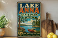 A vintage-style sign for Lake Anna State Park in Virginia, featuring a scenic illustration of a lake, trees, and a canoe.