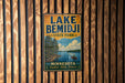 A vintage-style metal sign for Lake Bemidji State Park in Minnesota, featuring a scenic illustration of a lake surrounded by pine trees and a canoe.