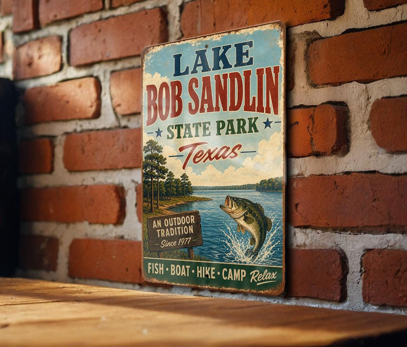 A vintage-style metal sign for Lake Bob Sandlin State Park in Texas, featuring a fish jumping out of the water and a sign that says "An Outdoor Tradition Since 1977".