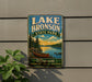 A vintage-style metal sign for Lake Bronson State Park in Minnesota, featuring a canoe on a lake and a scenic landscape.