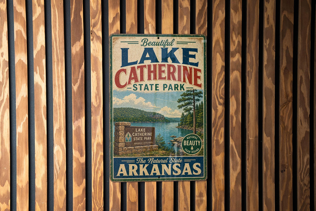 A vintage-style metal sign for Lake Catherine State Park in Arkansas, featuring a scenic landscape with a lake, mountains, and a sign indicating the park as the "Natural State of Arkansas".