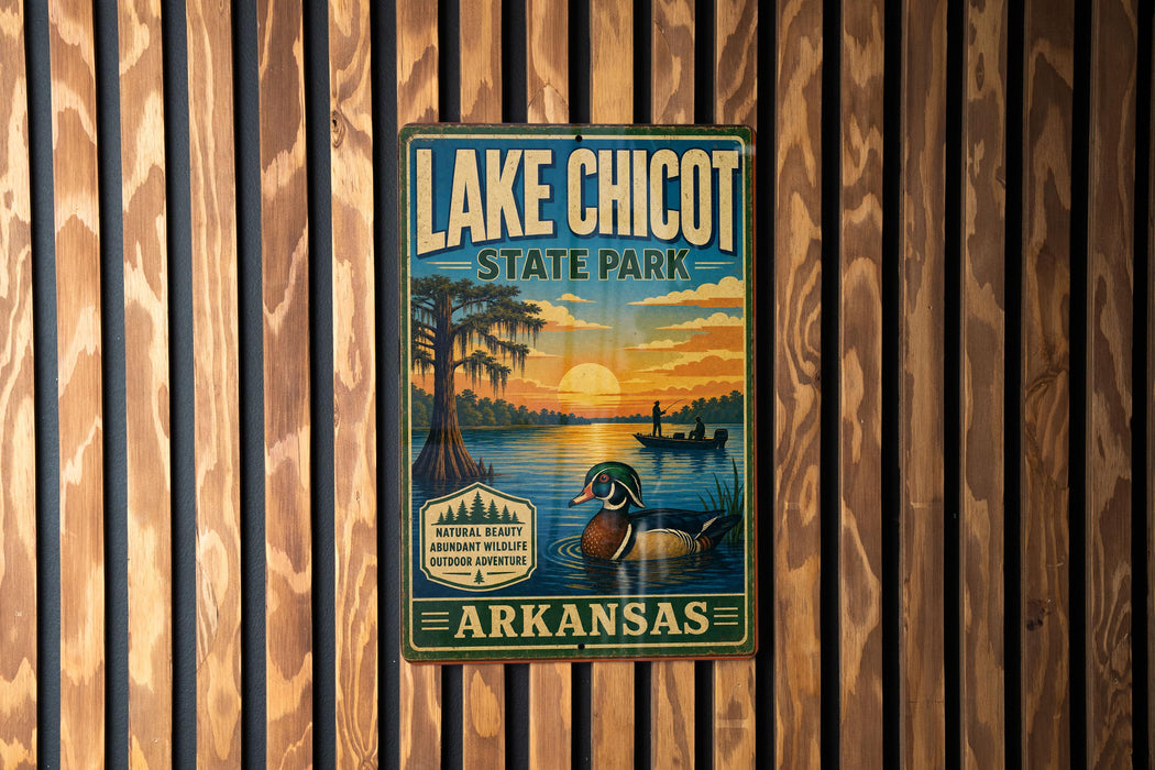 A vintage-style sign for Lake Chicot State Park in Arkansas, featuring a duck and a sunset over a lake.