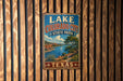 A vintage-style metal sign for Lake Colorado City State Park in Texas, featuring a scenic landscape with a river, mountains, and a tree.