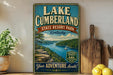 A vintage-style sign for Lake Cumberland State Resort Park in Kentucky, featuring a scenic illustration of the lake and surrounding landscape.