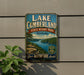 A vintage-style sign for Lake Cumberland State Resort Park in Kentucky, featuring a scenic landscape with a lake, mountains, and a boat.
