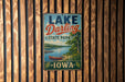 A vintage metal sign for Lake Darling State Park in Iowa, featuring a scenic image of a lake and a canoe.