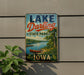 A vintage-style sign for Lake Darling State Park in Iowa, featuring a scenic landscape with a lake, trees, and a canoe.
