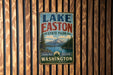 A vintage metal sign for Lake Easton State Park in Washington, featuring a scenic mountain landscape and a lake.