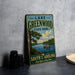 A vintage-style sign for Lake Greenwood State Park in South Carolina, featuring a scenic image of a lake with a boat and trees.