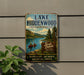 A vintage-style metal sign for Lake Hiddenwood State Recreation Area in South Dakota, featuring a scenic image of a lake surrounded by mountains and pine trees.