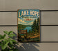 A vintage-style sign for Lake Hope State Park in Ohio, featuring a scenic landscape with a lake, forest, and mountains.