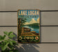 A vintage-style sign for Lake Logan State Park, featuring a scenic lake and surrounding landscape, is displayed on a wall.