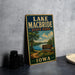 A vintage-style sign for Lake Macbride State Park in Iowa, featuring a scenic landscape with a lake, trees, and a path leading to the park entrance.