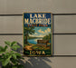 A vintage-style sign for Lake Macbride State Park in Iowa, featuring a scenic landscape with a lake, trees, and a path leading to the park entrance.