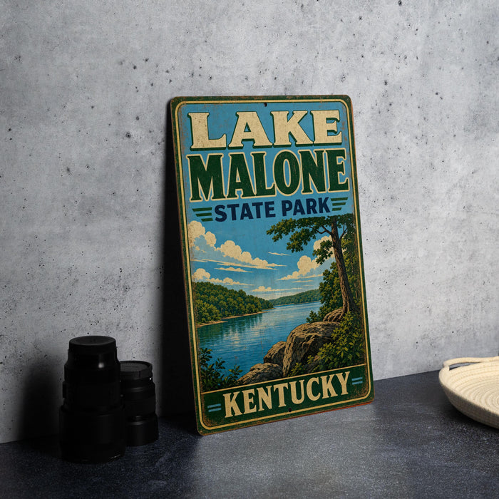 A vintage-style sign for Lake Malone State Park in Kentucky, featuring a scenic landscape with a lake, mountains, and trees.