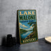 A vintage-style sign for Lake Malone State Park in Kentucky, featuring a scenic landscape with a lake, mountains, and trees.