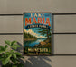 A vintage-style sign for Lake Maria State Park in Minnesota, featuring a scenic landscape with a lake, mountains, and pine trees.