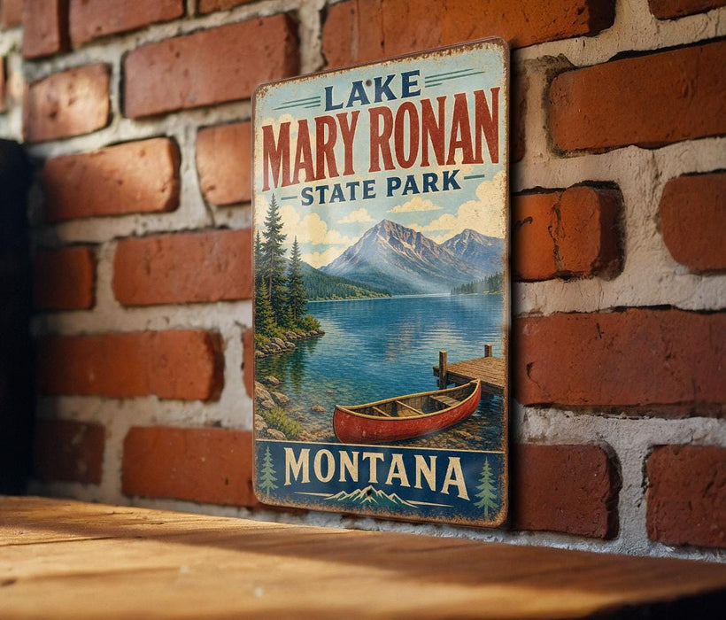 A vintage metal sign for Lake Mary Ronan State Park in Montana, featuring a scenic image of a lake, mountains, and a red canoe.
