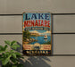 A vintage-style sign for Lake Minatare State Recreation Area in Nebraska, featuring a scenic image of a lake, mountains, and a sailboat.