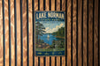 A vintage-style metal sign for Lake Norman State Park in North Carolina, featuring a scenic image of a lake, pine trees, and a sailboat.