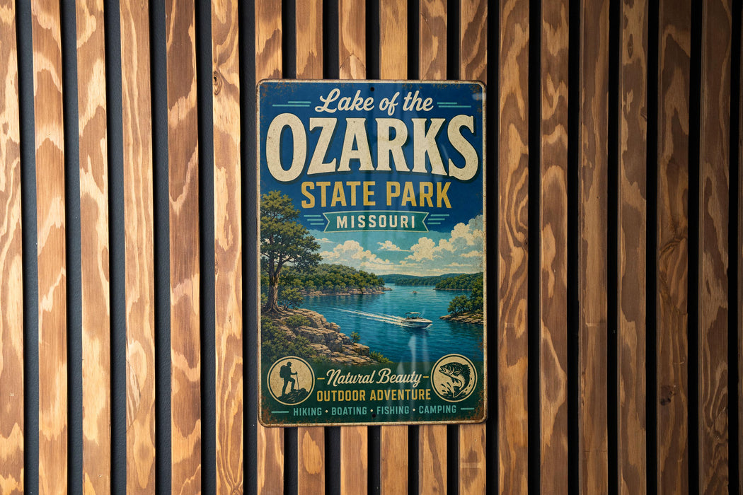 A vintage-style metal sign for Lake of the Ozarks State Park, Missouri, featuring a scenic landscape with a lake, mountains, and a boat.