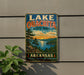 A vintage-style sign for Lake Ouchita State Park in Arkansas, featuring a scenic landscape with a lake, mountains, and trees.