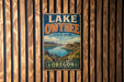 A vintage-style metal sign for Lake Owyhee State Park in Oregon, featuring a scenic landscape with mountains, water, and greenery.