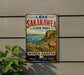 A vintage-style metal sign for Lake Sakakawea State Park in North Dakota, featuring a scenic landscape with a goat, sunflowers, and a body of water.