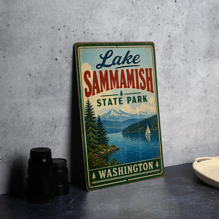 A vintage-style sign for Lake Sammish State Park in Washington, featuring a scenic landscape with a lake, mountains, and a sailboat.