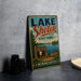 A vintage-style sign for Lake Shetek State Park in Minnesota, featuring a scenic illustration of the park and its surroundings.