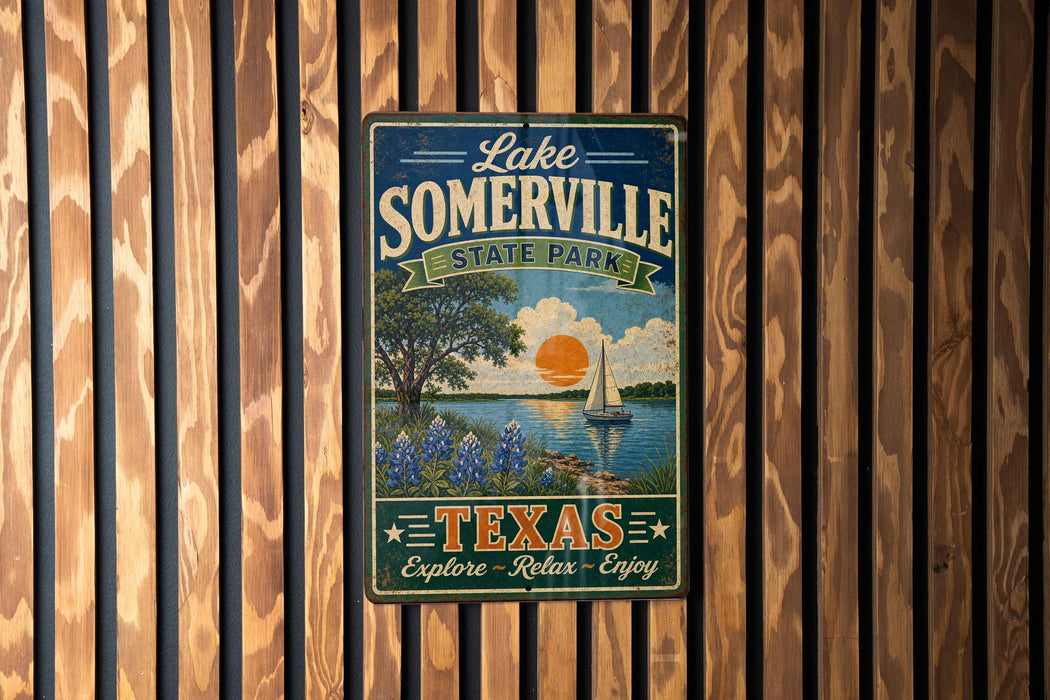 A vintage-style metal sign for Lake Somerville State Park in Texas, featuring a scenic landscape with a sailboat and a sunset over the water.