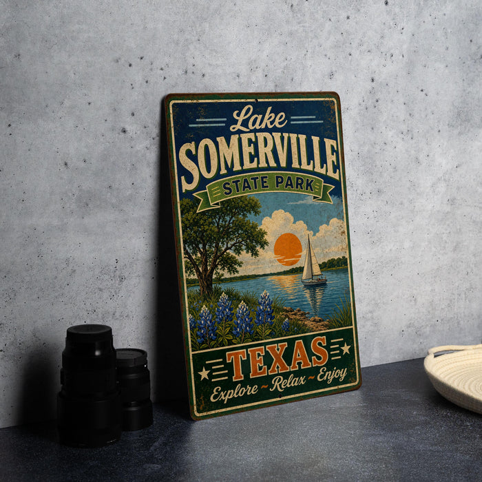 A vintage-style sign for Lake Somerville State Park in Texas, featuring a scenic illustration of a lake, trees, and a sailboat.