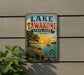 A vintage-style sign for Lake Tawakoni State Park in Texas, featuring a scenic illustration of a lake, sailboat, and sunset.