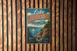 A vintage metal sign for Lake Thunderbird State Park in Oklahoma, featuring a scenic illustration of the park's natural landscape.