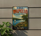 A vintage-style sign for Lake Wapollo State Park in Iowa, featuring a scenic landscape with a sailboat on the lake and lush greenery.