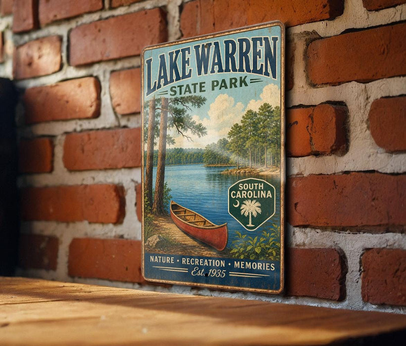 A vintage-style metal sign for Lake Warren State Park, featuring a scenic illustration of a lake, trees, and a canoe, mounted on a brick wall.